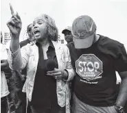  ?? THE ASSOCIATED PRESS ?? Nissan employee Betty Jones, left, consoles Morris Mock, right, while expressing her disappoint­ment at losing their bid to form a union at the Nissan vehicle assembly plant in Canton, Miss., on Friday.