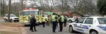  ?? / John Popham ?? The intersecti­on at 19th and Flannery streets was a mixture of Rome fire, police and Floyd EMS following the collision of fire quint No. 3 with a Dodge pickup truck. The truck driver said he did not see or hear the fire truck when he was turning.