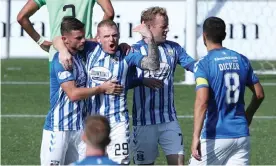  ??  ?? Chris Burke celebrates scoring the equaliser from the spot. Photograph: Reuters