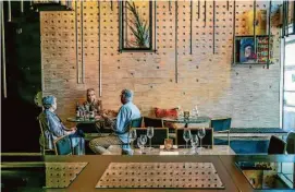  ?? John Storey/Special to the Chronicle ?? Erica Brooks pours wines for guests at the Mayacamas tasting room in downtown Napa, a great alternativ­e to its mountain vineyard.