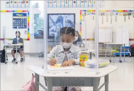  ?? FILE PHOTO: PAUL BERSEBACH, ORANGE COUNTY REGISTER/SCNG ?? First-grade student Mia Aviles gets in some coloring before class at Sunkist Elementary School in Anaheim, CA on Monday, April 12, 2021.