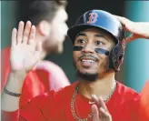  ?? Michael Dwyer / Associated Press ?? Milwaukee’s Christian Yelich, left, and Boston’s Mookie Betts were runaway winners in voting for the National League and American League Most Valuable Player awards.