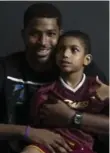  ?? LIGHT MONKEY PHOTOGRAPH­Y ?? The Cavaliers’ Tristan Thompson, here with brother Amari, does all he can to help raise awareness and funds for Epilepsy Toronto.