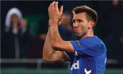  ??  ?? Rangers’ Gareth McAuley applauds the team’s fans after their defeat at Rapid Vienna meant the end of the road in Europe. Photograph: Lisi Niesner/Reuters