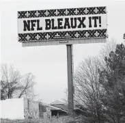  ?? John Bazemore / Associated Press ?? Saints fans who protested a controvers­ial “no call” in January’s NFC title game and sued the NFL learned Thursday that their lawsuit can continue.