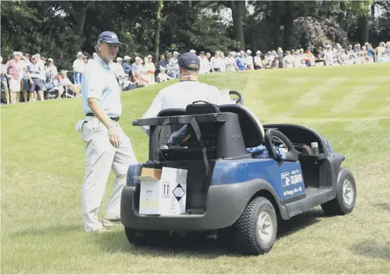  ??  ?? 2 Ernie Els talks to rules official Simon Higginbott­om afer deciding he had replaced his ball incorrectl­y on day one of the BMW PGA Championsh­ip at Wentworth.