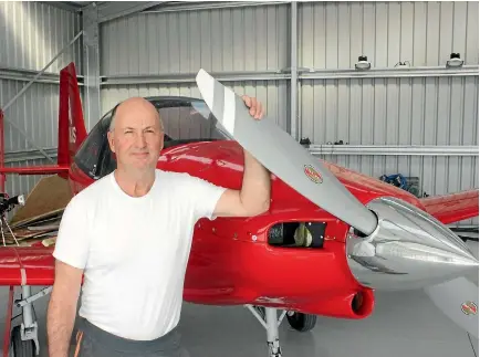  ?? JO MCKENZIE-MCLEAN/STUFF ?? Neil Sutherland, who lives at the Alexandra Airport at his hanger, will be displaying his home-built plane at the Wings ‘n Wheels event at the Alexandra Blossom Festival tomorrow.