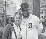 ?? ERIC GUZMÁN/DETROIT FREE PRESS ?? Araceli Ambers, 41, and Kevin Ambers, 39, both of Detroit, enjoy the tailgating festivitie­s for Opening Day at Grand Circus Park on Friday.