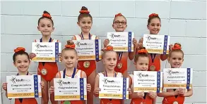  ?? ?? Baskervill­es Gymnastics Club’s girls’ squad with their medals and awards at the Regional and County Grades competitio­n