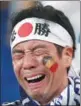  ?? REUTERS ?? A heartbroke­n Japan fan after Monday’s 3-2 loss to Belgium.