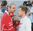  ?? Foto: dpa ?? Teamchef Maurizio Arrivabene musste Sebastian Vettel beruhigen.