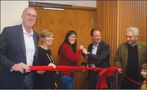  ?? NEWS PHOTO JEREMY APPEL ?? Medicine Hat Public Library board chair Rose Sanchez and Mayor Ted Clugston cut the ribbon to the library's newly-renovated theatre. Pictured are MP Glen Motz, Shelley Beck, constituen­cy assistant to Cypress-Medicine Hat MLA Drew Barnes, Sanchez,...