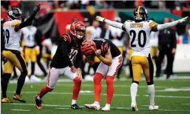  ?? Pittsburgh Steelers. Photograph: Sam Greene/USA Today Sports ?? Evan McPherson (centre) reacts after missing a field goal during overtime against the