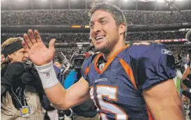  ?? | AP ?? Former Broncos quarterbac­k Tim Tebow is trying his hand at baseball these days.