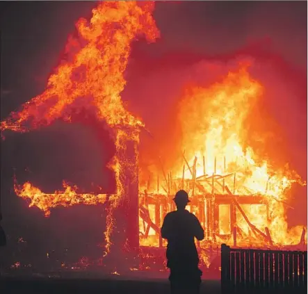  ?? Noah Berger Associated Press ?? “REBUILDING PARADISE” deals with the November 2018 fires in Paradise, Calif., which displaced about 50,000 residents.