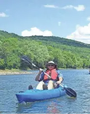  ?? FILE ?? A kayaker paddles down the Susquehann­a River during a summertime trip. Chemung River Friends remind residents winter is not a safe time for paddlers to be on the water.