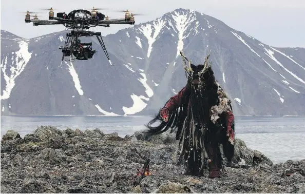  ?? CLEARWATER DOCUMENTAR­Y/THE CANADIAN PRESS ?? A drone films a shaman character on the Russian Bering Strait during a scene from The Great Human Odyssey series, which aired on CBC’s The Nature of Things and PBS. The Edmonton production has earned an Emmy nomination.