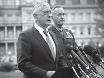  ?? ASSOCIATED PRESS ?? Defense Secretary Jim Mattis (left), accompanie­d by Joint Chiefs Chairman General Joseph Dunford, speaks to members of the media outside the West Wing of the White House in Washington, regarding the escalating crisis in North Korea's nuclear threats.