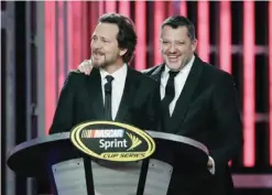  ??  ?? LAS VEGAS: Eddie Vedder, left, and Tony Stewart stand on the stage during the NASCAR Sprint Cup Series auto racing awards Friday, in Las Vegas. — AP