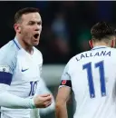  ??  ?? ADAM LALLANA celebrates scoring England’s second goal with Wayne Rooney as it defeated Scotland 3-0 in their World Cup qualifier in London on Friday.