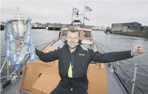  ??  ?? 0 Arthur Numan on board the Fraserburg­h lifeboat ahead of Rangers’ William Hill Scottish Cup-tie in the Highlands on Sunday.