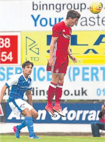  ?? Pictures: SNS Group. ?? Left: Saints debutant Scott Tanser holds off Shay Logan; above: Ryan Christie leaps to head in Aberdeen’s second goal just before half-time.