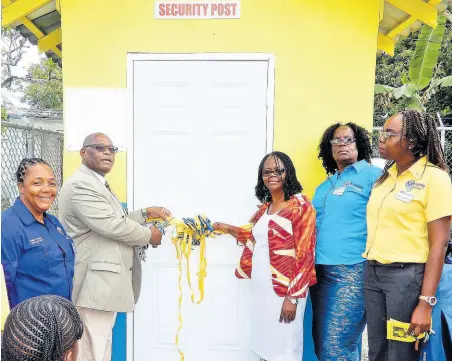  ?? CONTRIBUTE­D ?? Kiwanis District Governor for Eastern Canada and the Caribbean, Melford Clarke (second left), and principal Sherron Minott of Breadnut Hill Primary School (third left), officially opening the security booth at the school, that was constructe­d by Kiwanis Internatio­nal Division 24. Sharing the occasion (from left), are Donna Coombs, lieutenant governor, Kiwanis Division 24, Beverley Wilson, president, Kiwanis Club Moneague, and Julian Gordon, president, Kiwanis Club Ocho Rios.