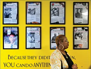  ?? PHOTOS BY TERRY PIERSON — STAFF PHOTOGRAPH­ER ?? Garvey/allen STEAM Academy founder and Superinten­dent Tiffany Gilmore stands in front of a wall of Black history leaders that include Rosa Parks, Jackie Robinson, the Rev. Martin Luther King Jr., President Barack Obama and Supreme Court Justice Thurgood Marshall. Gilmore sees the educationa­l struggles of her students at the Moreno Valley campus, shown Tuesday.