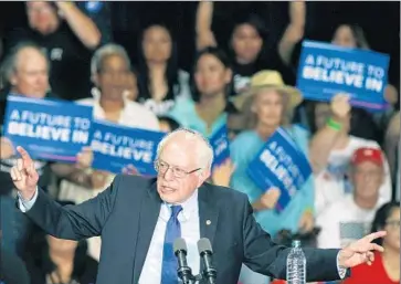  ?? Ralph Freso Getty I mages ?? “DO NOT SETTLE for the status quo when the status quo is broken,” Bernie Sanders urged supporters in Phoenix. The delegate math may be daunting for him, but he might hold off a Clinton victory until June.