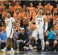  ?? MIKE KROPF/AP ?? Virginia’s Jayden Gardner (1) celebrates during the second half of Tuesday night’s game against Clemson. Gardner finished with 12 points and nine rebounds.