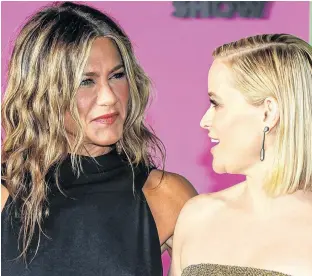  ?? EDUARDO MUNOZ/REUTERS ?? Reese Witherspoo­n (right) and Jennifer Aniston arrive to the global premiere for Apple’s “The Morning Show” at the Lincoln Center in New York on Oct. 28, 2019.