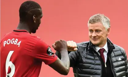  ??  ?? The Manchester United midfielder Paul Pogba (left) with manager Ole Gunnar Solskjaer after their victory against Bournemout­h last Saturday. Photograph: Peter Powell/AFP/Getty Images