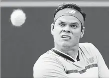  ?? CANADIAN PRESS FILE PHOTO ?? Milos Raonic returns a shot to Frances Tiafoe during second-round men’s Rogers Cup tennis tournament action in Toronto on Aug. 8.