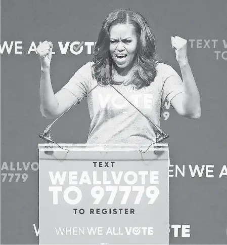  ?? PHOTOS BY ANDREW WEST/FORT MYERS NEWS-PRESS ?? Michelle Obama speaks at the When We All Vote rally at the Watsco Center at the University of Miami on Friday.