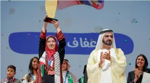  ?? File photo ?? Sheikh Mohammed and Afaf Sherif from Palestine, champion of the Arab Reading Challenge 2017, during last year’s ceremony —