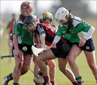  ??  ?? Aisling Prendergas­t and Cria Langton of St. Mary’s apply pressure on St. Angela’s captain Abby Flynn.