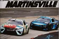  ?? Jared C. Tilton / Getty Images ?? Kyle Busch, left, and Ross Chastain drive during practice Friday for the Blue-Emu Maximum Pain Relief 400 in Martinsvil­le, Va.