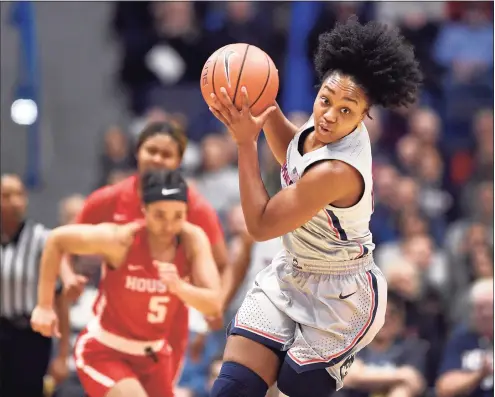  ?? Jessica Hill / Associated Press ?? Big East Preseason Player of the Year Christyn Williams and the Huskies will open the season Saturday against UMass-Lowell.