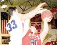  ?? RICK PECK/SPECIAL TO MCDONALD COUNTY PRESS ?? McDonald County’s Tim Shields gets fouled by East Newton’s Dustin McDermott during the Mustangs’ 60-45 win on Feb. 2 at East Newton High School. Shields finished with a career-high 25 points to lead McDonald County.