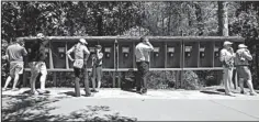  ?? AP/CHARLIE RIEDEL ?? One Masters patron had his badge-buying privileges revoked more than a decade ago for failing to adhere to Augusta National Golf Club’s no cell-phone policy. Patrons should instead use this bank of phones at the main entrance where they can place free...