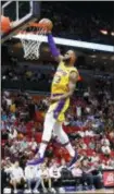  ?? BRYNN ANDERSON — THE ASSOCIATED PRESS ?? Lakers forward LeBron James scores during the first quarter.