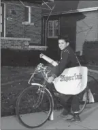  ??  ?? A young carrier delivers The Hamilton Spectator: News, entertainm­ent, weather, sports and fresh ideas brought daily, right to your doorstep.