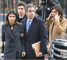  ?? Craig Ruttle / Associated Press ?? Michael Cohen, second from right, President Donald Trump’s former lawyer, accompanie­d by his children, from left, Samantha and Jake, and his wife, Laura Shusterman, right, arrives at federal court for his sentencing for dodging taxes, lying to Congress and violating campaign finance laws on Wednesday in New York.