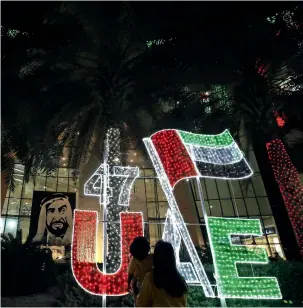  ??  ?? Al Wahda Mall lit up in colours of the UAE flag as part of the 47th National Day. —