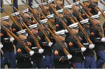  ?? ASSOCIATED PRESS FILE PHOTO ?? Marines march during President Donald Trump’s inaugurati­on parade last year in Washington. Trump’s lofty vision of big tanks and vintage aircraft moving through the streets of Washington in a show of patriotic force crumbled Friday under the weight of logistics, including a $92 million price tag.