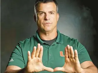  ?? MIKE STOCKER/SOUTH FLORIDA SUN SENTINEL ?? Hurricanes coach Mario Cristobal looks to add quarterbac­k prospect Luka Moga to UM’s 2024 recruiting class.