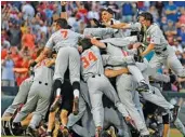  ?? THE ASSOCIATED PRESS ?? Oregon State players celebrate beating Arkansas 5-0 to win the College World Series on Thursday night in Omaha, Neb.