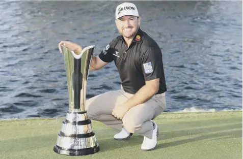  ??  ?? 0 Graeme Mcdowell shows off the Saudi Internatio­nal silverware after his two-shot success at Royal Greens Golf Club.