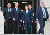  ?? J. SCOTT APPLEWHITE/AP ?? President Joe Biden, left, and House Speaker Mike Johnson, R-LA., join Irish Prime Minister Leo Varadkar Friday on the steps of the Capitol in Washington.