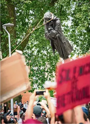  ??  ?? The edward Colston statue being pulled down by people protesting racism in Bristol on June 7. — KeIR GRaVIL/Reuters